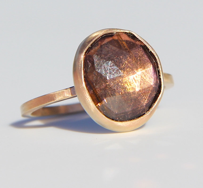 Purple-brown tourmaline ring in gold