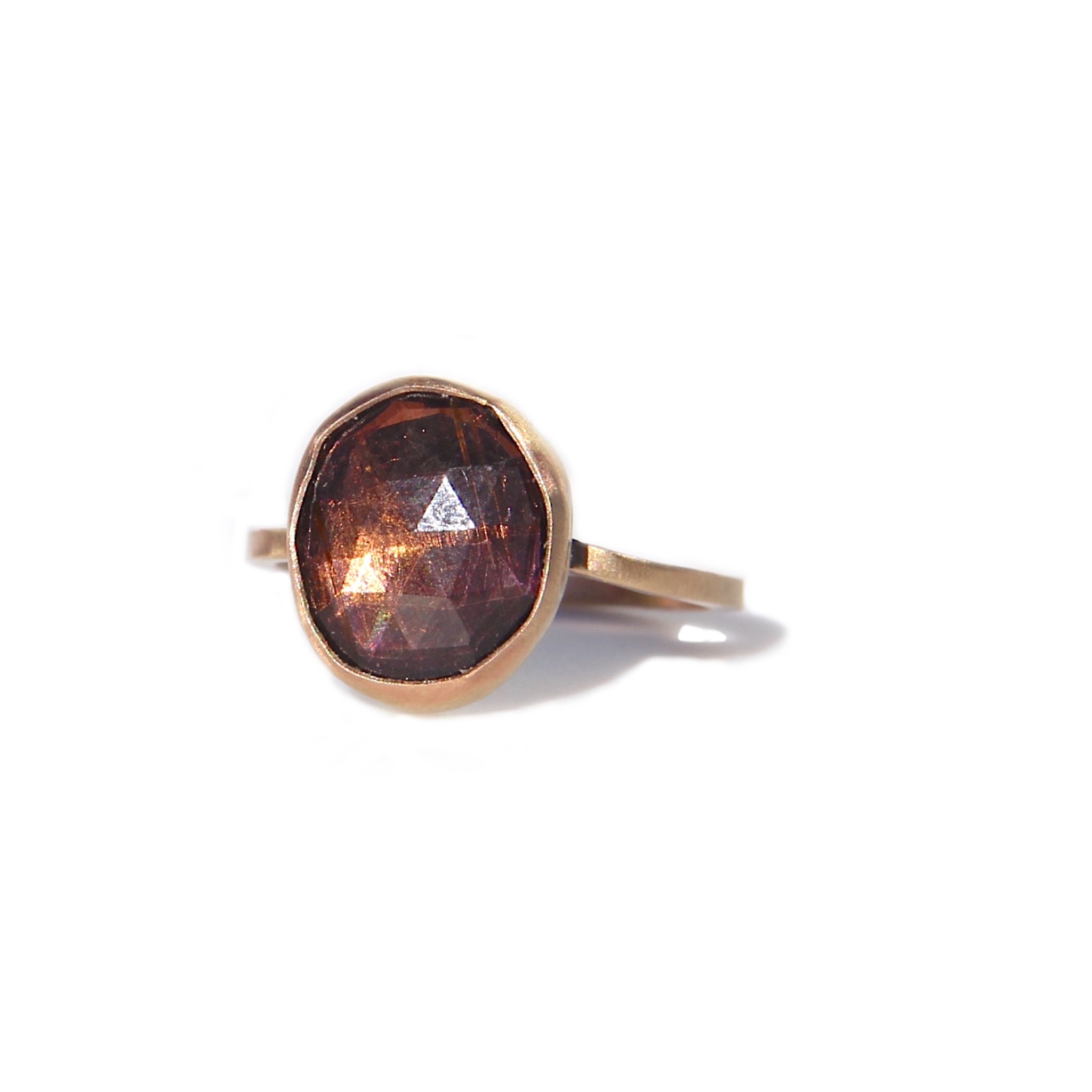 Purple-brown tourmaline ring in gold