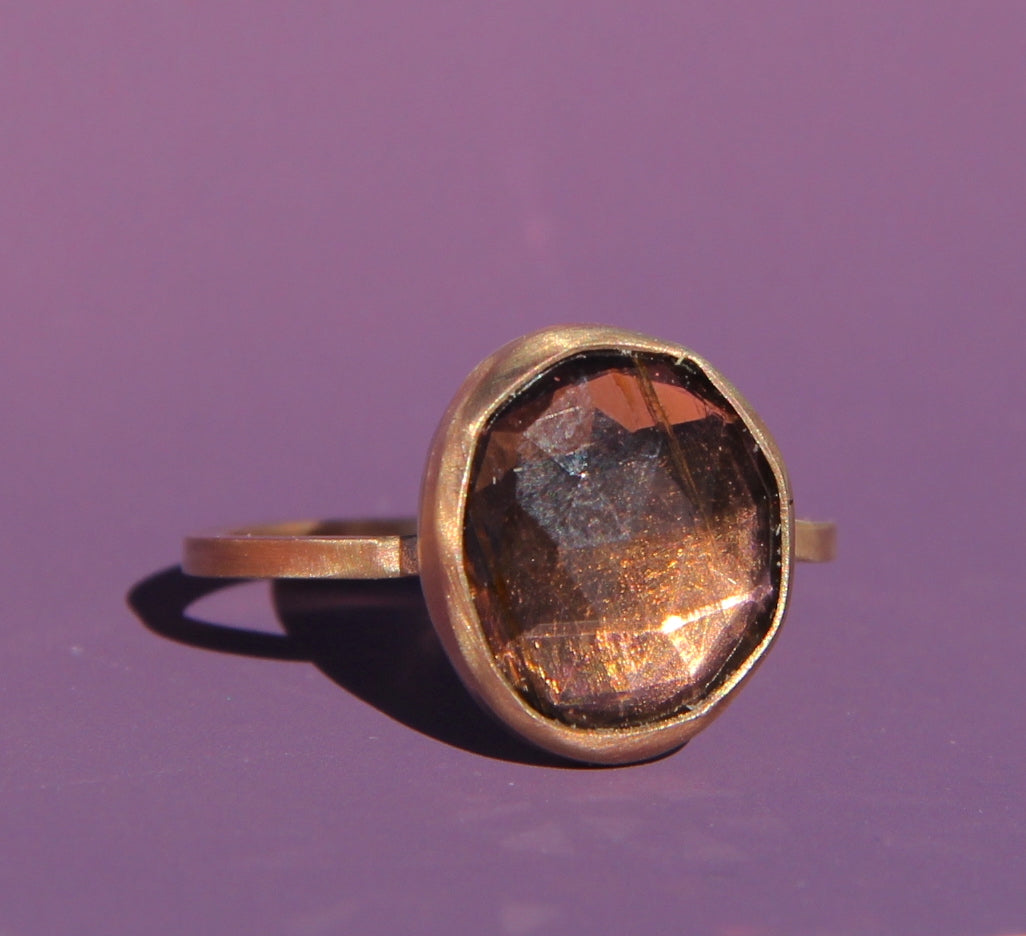 Purple-brown tourmaline ring in gold