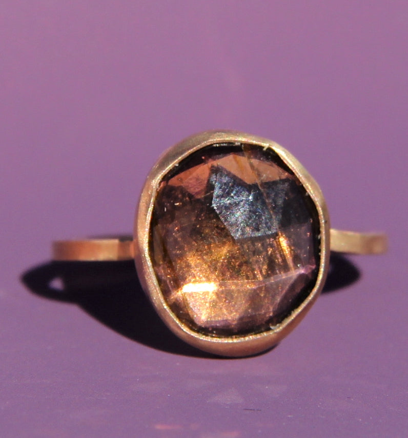 Purple-brown tourmaline ring in gold