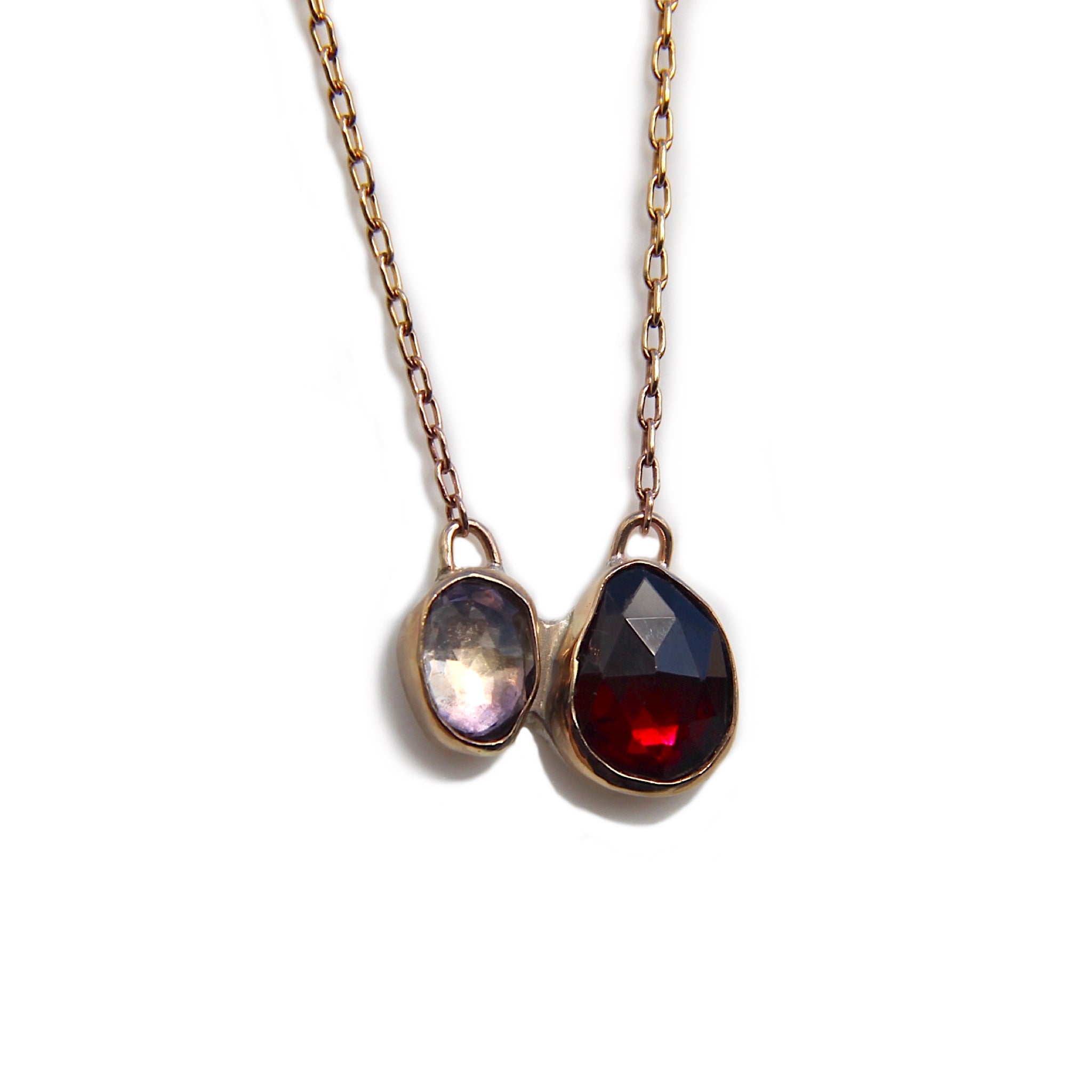 A diptyque style necklace with garnet and ametrine