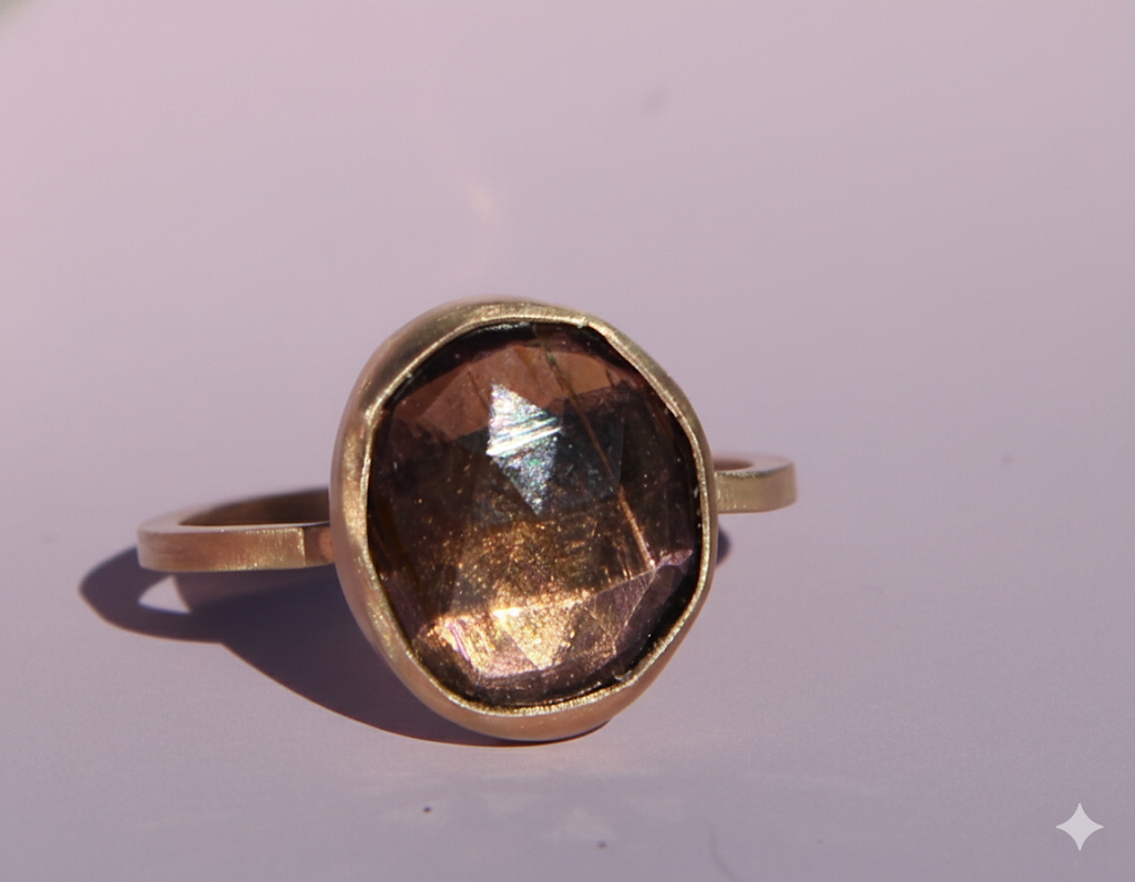 Purple-brown tourmaline ring in gold