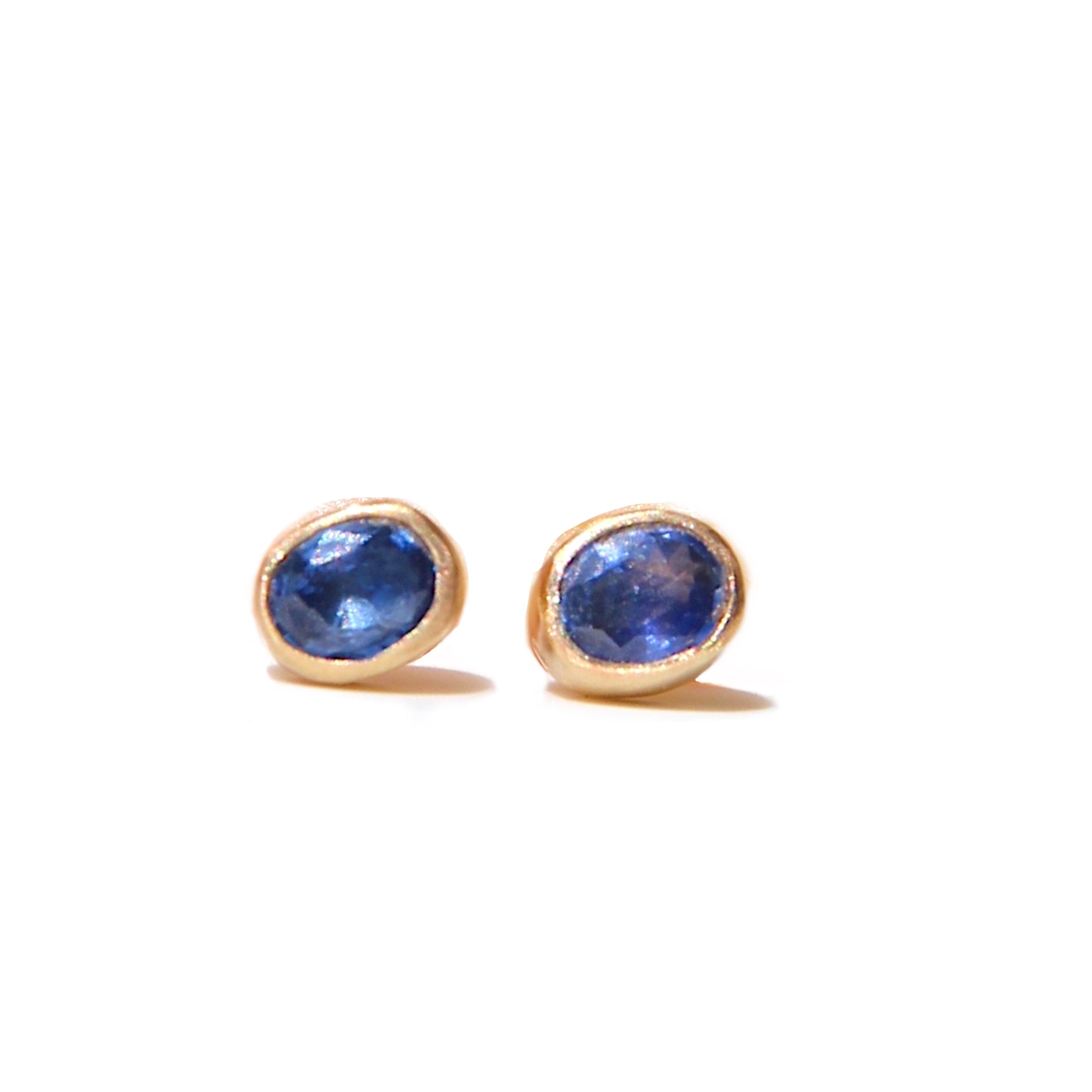 Bright Blue Oval Sapphire stud earrings in gold