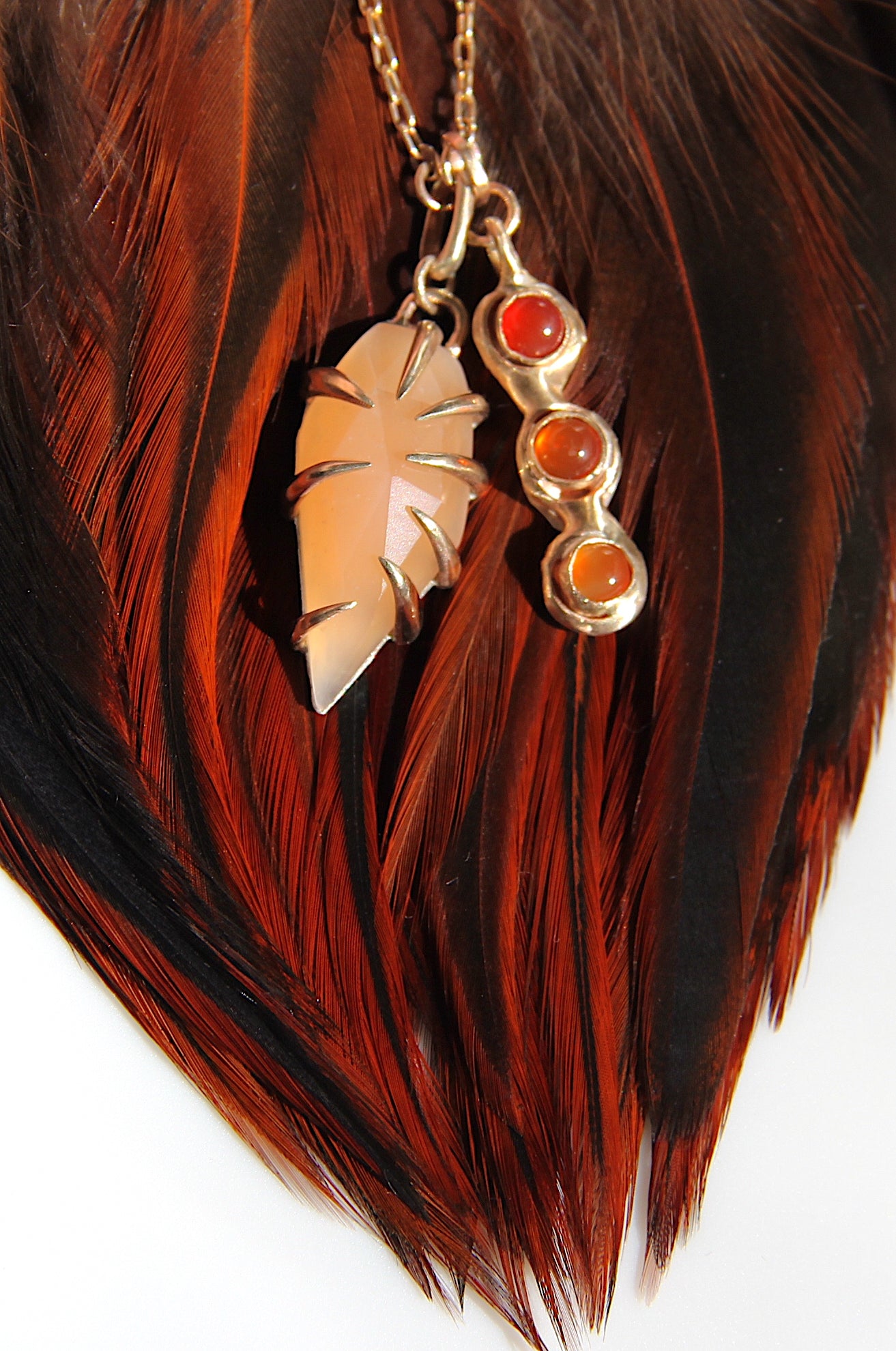 Peach Moonstone with triple carnelian charm