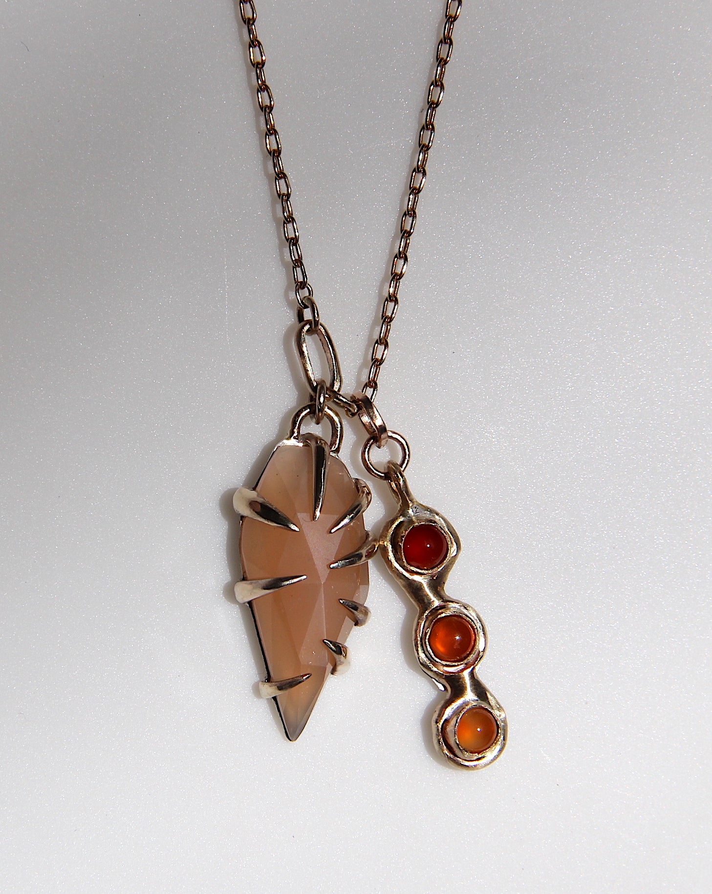 Peach Moonstone with triple carnelian charm