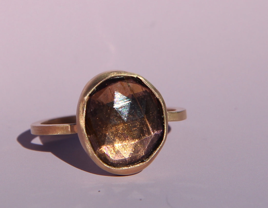 Purple-brown tourmaline ring in gold