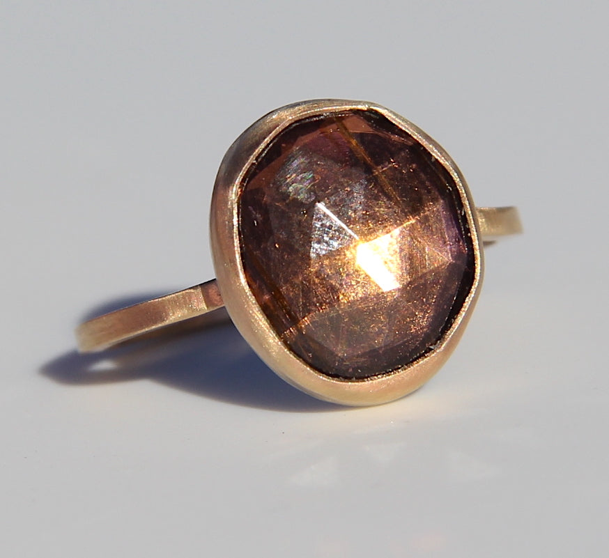 Purple-brown tourmaline ring in gold