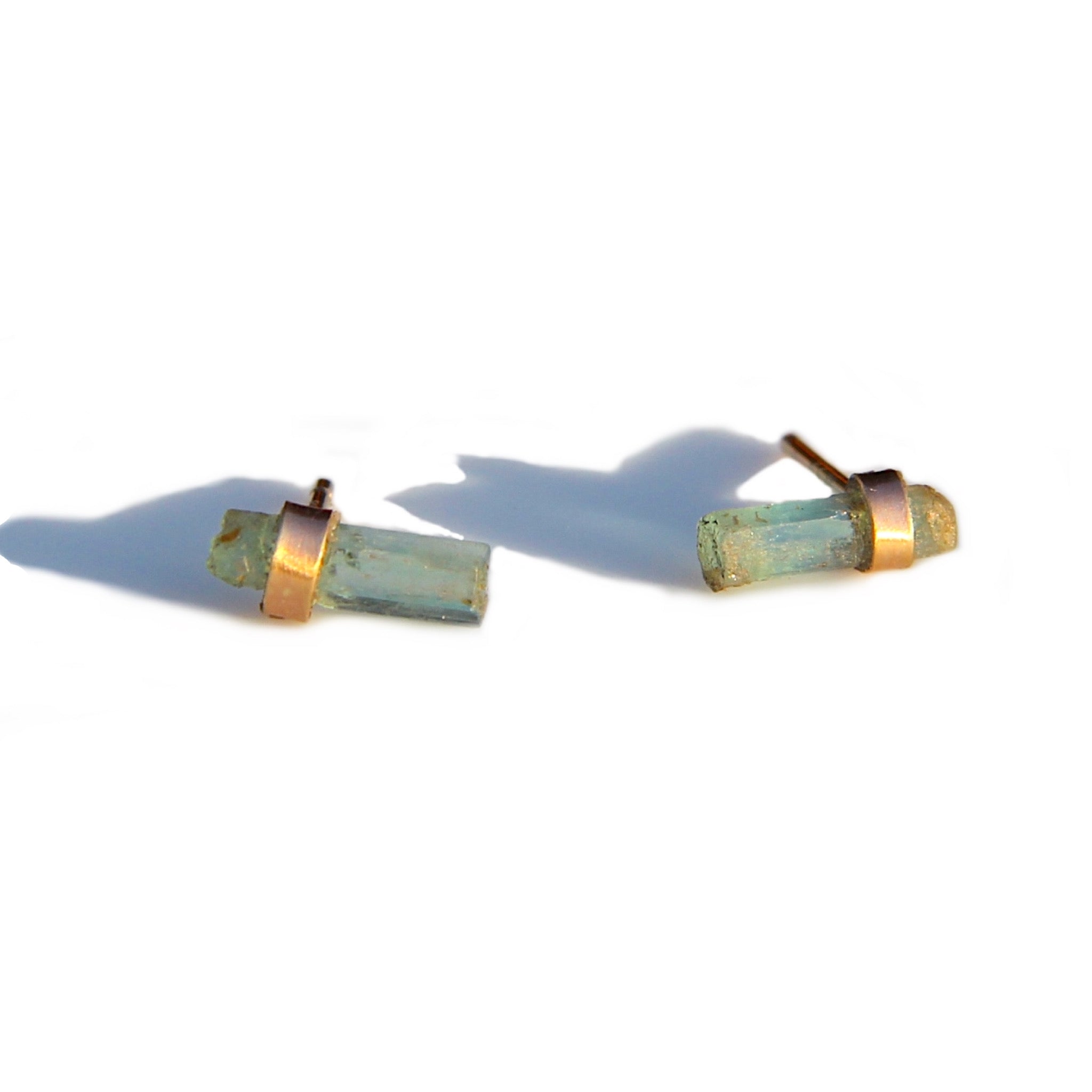 Raw emeralds in a green-blue hue