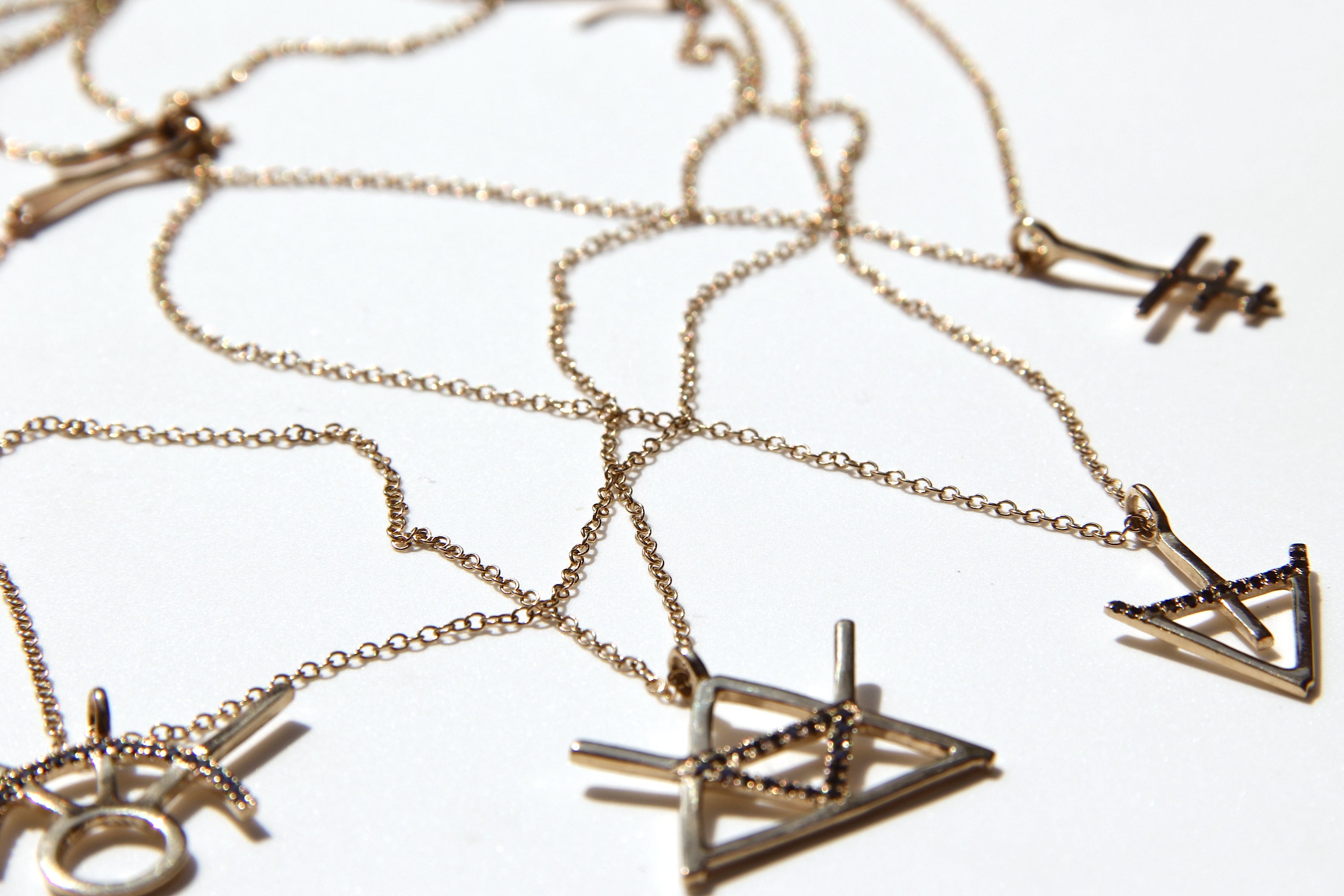 Alchemy Fire Symbol in 14K gold with black diamonds
